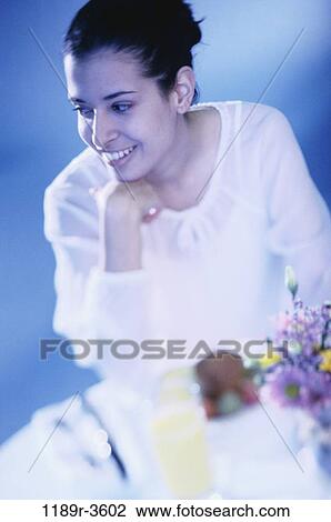 Stock Image - people, eating, woman, morning, Hispanic, breakfast, food. Fotosearch