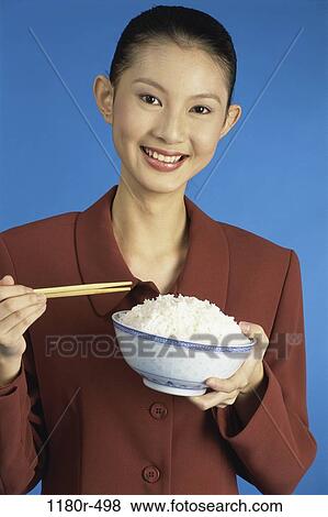 people, eating, woman, smiling, Asian, chopsticks, bowl View Large Photo Image Stock Photo - people, eating, woman, smiling, Asian, chopsticks, bowl. Fotosearch