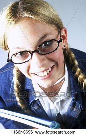 Stock Photograph - people, eyeglasses, blond, braids, indoors, teenager. Fotosearch