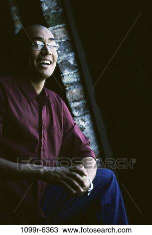 people, eyeglasses, sitting, indoors, shadowed View Large Photo Image Stock Image - people, eyeglasses, sitting, indoors, shadowed. Fotosearch