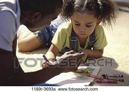 Stock Image - people, floor, book, coloring, family, father, crayons. Fotosearch