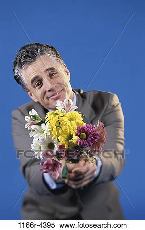 people, flowers, Middle-aged, brunette, indoors, Caucasian View Large Photo Image Stock Photography - people, flowers, Middle-aged, brunette, indoors, Caucasian. Fotosearch