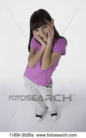 people, girl, child, brunette, shy, indoors, embarrassed View Large Photo Image Stock Image - people, girl, child, brunette, shy, indoors, embarrassed. Fotosearch