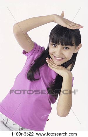 Stock Image - people, girl, child, posing, brunette, indoors, Caucasian. Fotosearch