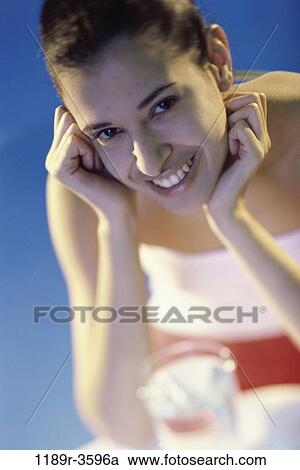 Stock Image - people, glass, water, woman, Hispanic, drinking, brunette. Fotosearch