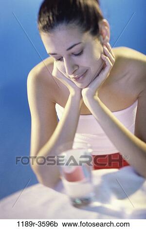 Stock Image - people, glass, water, woman, Hispanic, drinking, brunette. Fotosearch