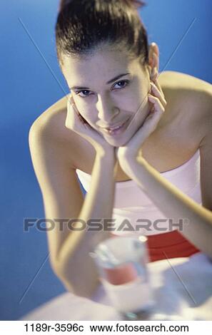 Stock Image - people, glass, water, woman, Hispanic, drinking, brunette. Fotosearch