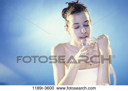 people, glass, water, woman, Hispanic, drinking, brunette View Large Photo Image Stock Image - people, glass, water, woman, Hispanic, drinking, brunette. Fotosearch