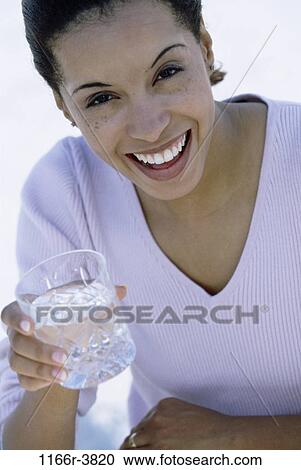 people, glass, water, woman, smiling, healthy, drinking View Large Photo Image Stock Image - people, glass, water, woman, smiling, healthy, drinking. Fotosearch