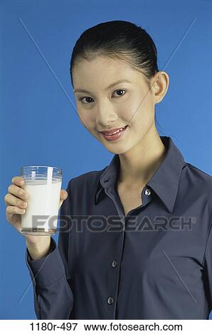 people, glass, woman, smiling, Asian, healthy, milk View Large Photo Image Stock Photo - people, glass, woman, smiling, Asian, healthy, milk. Fotosearch