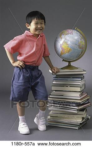Stock Image - people, globe, Asian, books, boy, leaning, child. Fotosearch