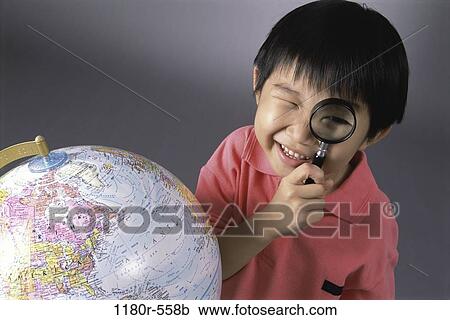 Stock Image - people, globe, Asian, boy, looking, child, education. Fotosearch
