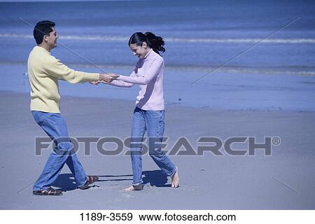 people, hands, couple, beach, holding, jeans, clothed View Large Photo Image Stock Photo - people, hands, couple, beach, holding, jeans, clothed. Fotosearch
