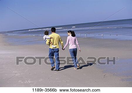 Stock Image - people, hands, walking, beach, holding, carrying, family. Fotosearch