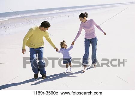 Stock Image - people, hands, walking, Hispanic, beach, holding, family. Fotosearch