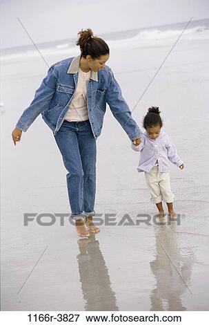 people, hands, walking, mother, beach, holding, family View Large Photo Image Stock Photo - people, hands, walking, mother, beach, holding, family. Fotosearch
