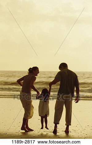people, hands, water, dusk, beach, holding, silhouette View Large Photo Image Stock Photo - people, hands, water, dusk, beach, holding, silhouette. Fotosearch