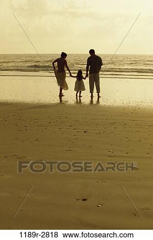 people, hands, water, walking, dusk, beach, holding View Large Photo Image Stock Photo - people, hands, water, walking, dusk, beach, holding. Fotosearch