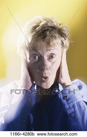people, hands, woman, ears, senior, stress, surprise View Large Photo Image Stock Image - people, hands, woman, ears, senior, stress, surprise. Fotosearch
