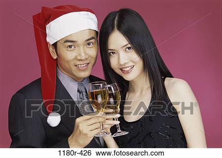 people, hat, celebration, Asian, couple, wine, Christmas View Large Photo Image Stock Photograph - people, hat, celebration, Asian, couple, wine, Christmas. Fotosearch