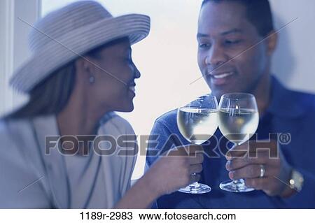 people, hat, couple, toasting, wine, drinking, toast View Large Photo Image Stock Image - people, hat, couple, toasting, wine, drinking, toast. Fotosearch