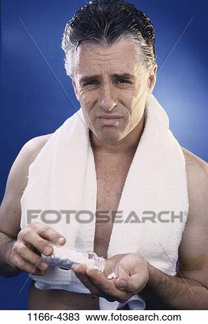 people, headache, bottle, medicine, Middle-aged, towel View Large Photo Image Stock Image - people, headache, bottle, medicine, Middle-aged, towel. Fotosearch