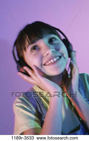 people, headset, listening, music, girl, child, indoors View Large Photo Image Stock Image - people, headset, listening, music, girl, child, indoors. Fotosearch