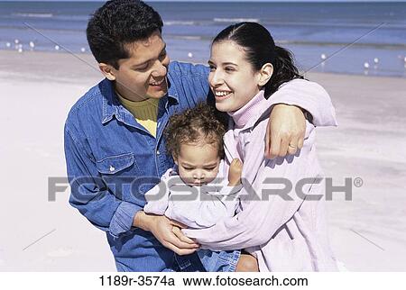 people, Hispanic, beach, hugging, unity, family, hug View Large Photo Image Stock Image - people, Hispanic, beach, hugging, unity, family, hug. Fotosearch