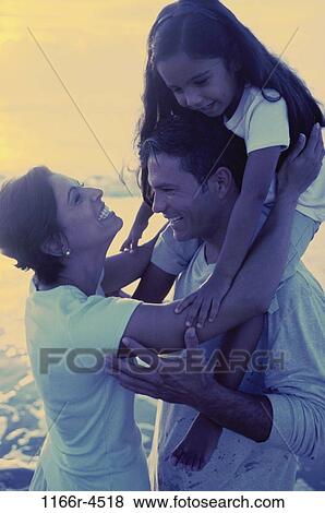people, Hispanic, beach, playful, carrying, family, daughter View Large Photo Image Stock Photo - people, Hispanic, beach, playful, carrying, family, daughter. Fotosearch