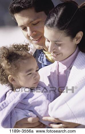 Stock Image - people, Hispanic, outdoors, hugging, family, hug, daughter. Fotosearch