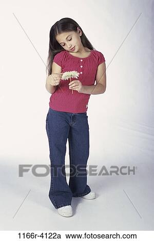 Stock Image - people, holding, girl, flower, child, admiring, brunette. Fotosearch
