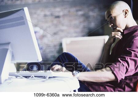 Stock Image - people, home, computer, contemplation, contemplating, thinking. Fotosearch