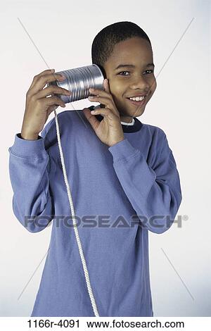 people, industry, telephone, can, listening, phone, boy View Large Photo Image Stock Image - people, industry, telephone, can, listening, phone, boy. Fotosearch