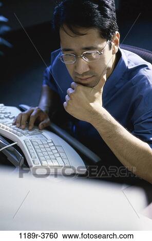 people, keyboard, Asian, eyeglasses, computer, contemplation View Large Photo Image Stock Image - people, keyboard, Asian, eyeglasses, computer, contemplation. Fotosearch
