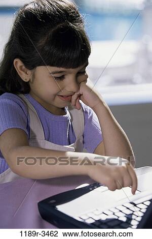 people, keyboard, Hispanic, computer, laptop, typing, girl View Large Photo Image Stock Image - people, keyboard, Hispanic, computer, laptop, typing, girl. Fotosearch