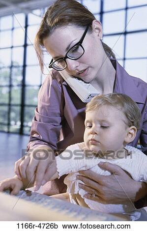 people, keyboard, mother, baby, phone, family, working View Large Photo Image Stock Image - people, keyboard, mother, baby, phone, family, working. Fotosearch