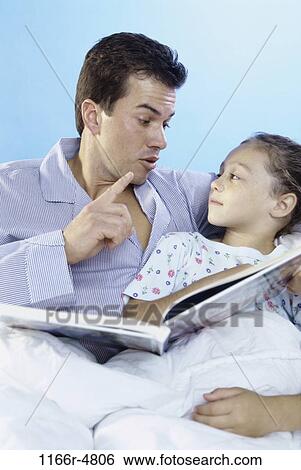 people, listening, reading, bed, book, gesturing, family View Large Photo Image Stock Photograph - people, listening, reading, bed, book, gesturing, family. Fotosearch