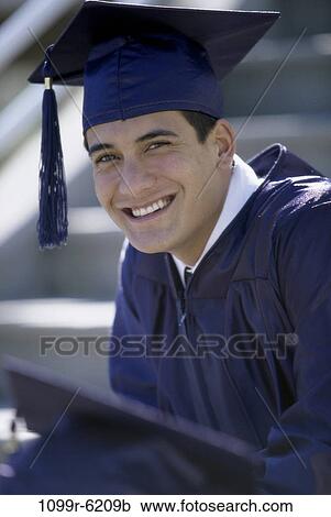 Stock Image - people, male, outdoors, achievement, cap, education, student. Fotosearch