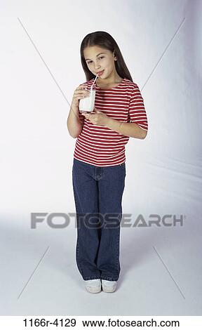 Stock Photo - people, milk, drinking, girl, straw, child, dairy. Fotosearch