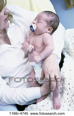 people, mother, baby, bed, family, brunette, dummy View Large Photo Image Stock Photography - people, mother, baby, bed, family, brunette, dummy. Fotosearch