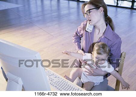 people, mother, baby, computer, phone, family, brunette View Large Photo Image Stock Image - people, mother, baby, computer, phone, family, brunette. Fotosearch