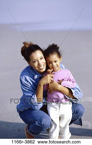 people, mother, beach, family, daughter, portrait, parent View Large Photo Image Stock Image - people, mother, beach, family, daughter, portrait, parent. Fotosearch