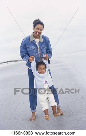 people, mother, beach, swinging, swing, playful, lifting View Large Photo Image Stock Photo - people, mother, beach, swinging, swing, playful, lifting. Fotosearch