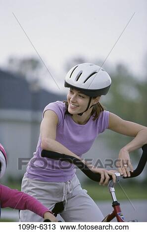 people, mother, Hispanic, bicycle, helmet, outdoors, family View Large Photo Image Stock Image - people, mother, Hispanic, bicycle, helmet, outdoors, family. Fotosearch
