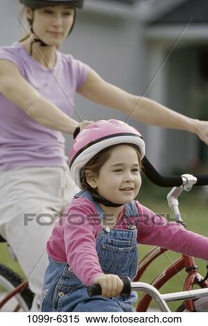 people, mother, Hispanic, bicycle, helmet, outdoors, family View Large Photo Image Stock Photography - people, mother, Hispanic, bicycle, helmet, outdoors, family. Fotosearch