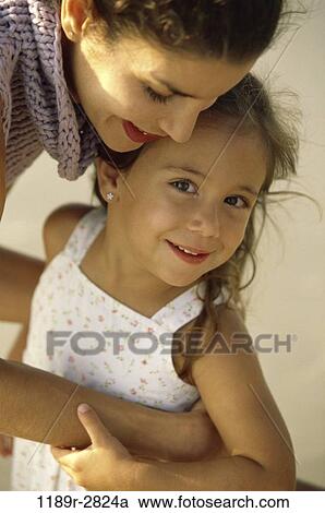 people, mother, Hispanic, holding, family, daughter, brunette View Large Photo Image Stock Image - people, mother, Hispanic, holding, family, daughter, brunette. Fotosearch