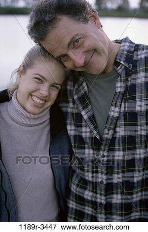 people, outdoors, hugging, family, hug, father, daughter View Large Photo Image Stock Photo - people, outdoors, hugging, family, hug, father, daughter. Fotosearch