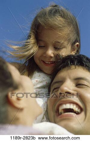 Stock Image - people, outdoors, hugging, joyous, family, hug, daughter. Fotosearch