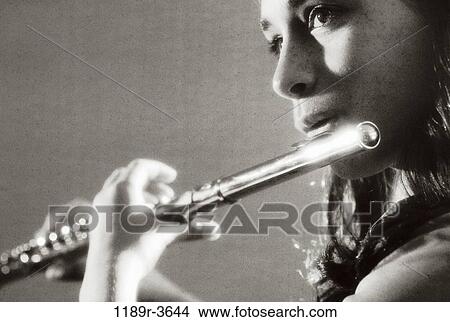 Picture - people, playing, arts, entertainment, play, flute. Fotosearch