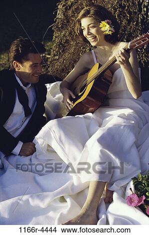 people, playing, couple, guitar, outdoors, wedding, play View Large Photo Image Picture - people, playing, couple, guitar, outdoors, wedding, play. Fotosearch